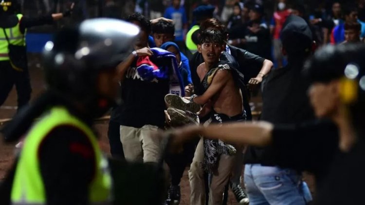 Stampede triggered by tear gas leaves at least 125 dead after Indonesia soccer match