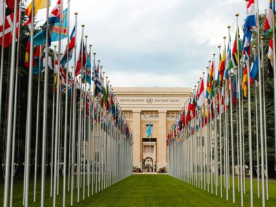 Flags outside the United Nations building, by Mathias Reding via Unsplash, May 24, 2020, https://unsplash.com/photos/flags-on-green-grass-field-near-brown-concrete-building-during-daytime-yfXhqAW5X0c.